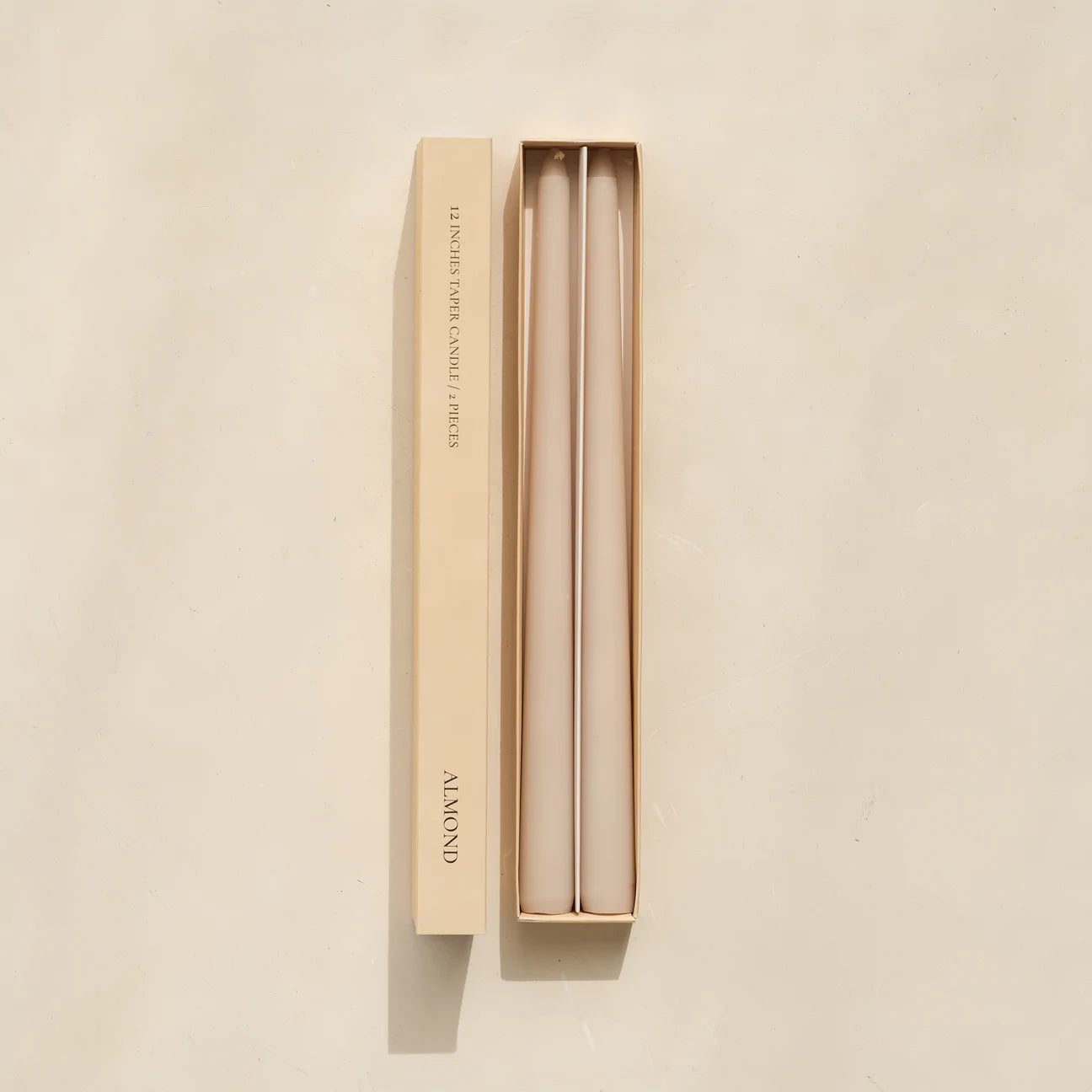 Soy taper candles set in almond available at Rook & Rose.