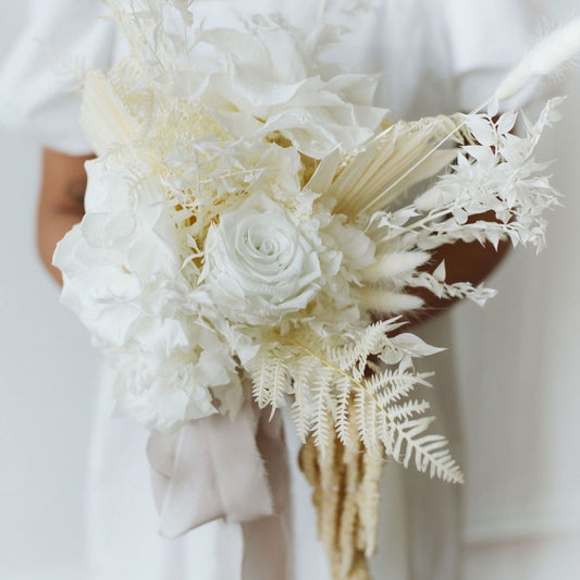 Photo is an example of a bridal bouquet with ivory accent color.