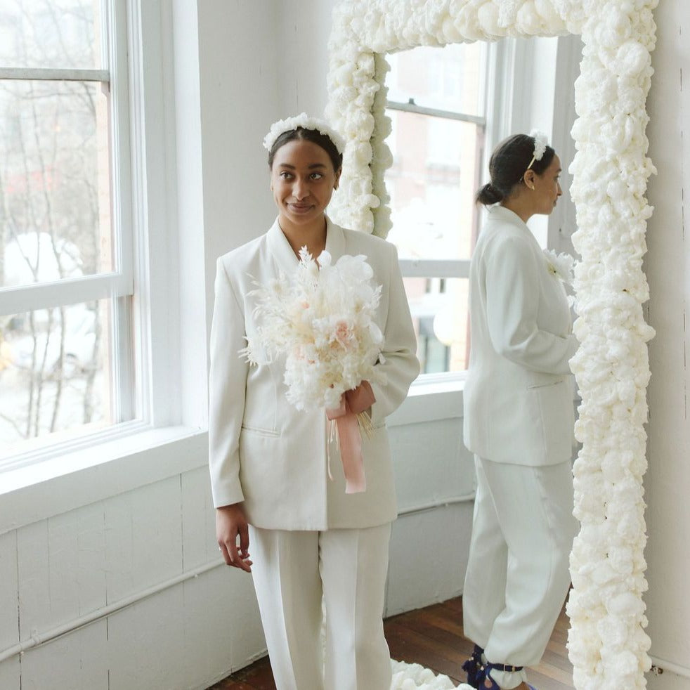 Photo is an example of a bridal bouquet with blush accent color.