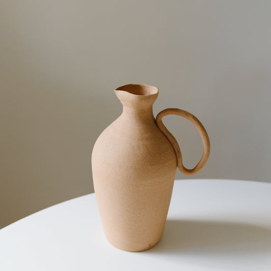 Caitlin Prince sand ceramic water pitcher available at Rook & Rose