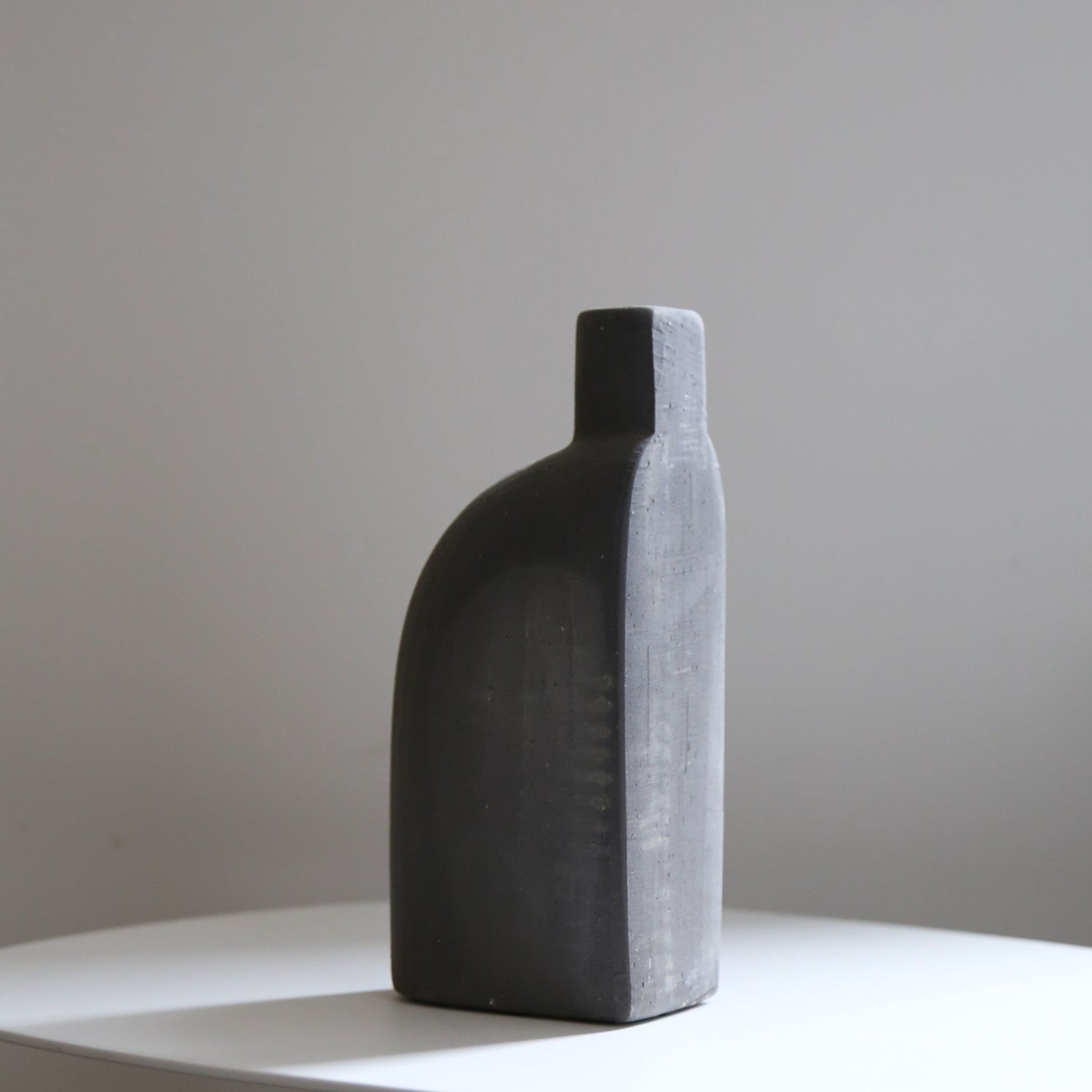 Black ceramic bud vase set available at Rook & Rose.