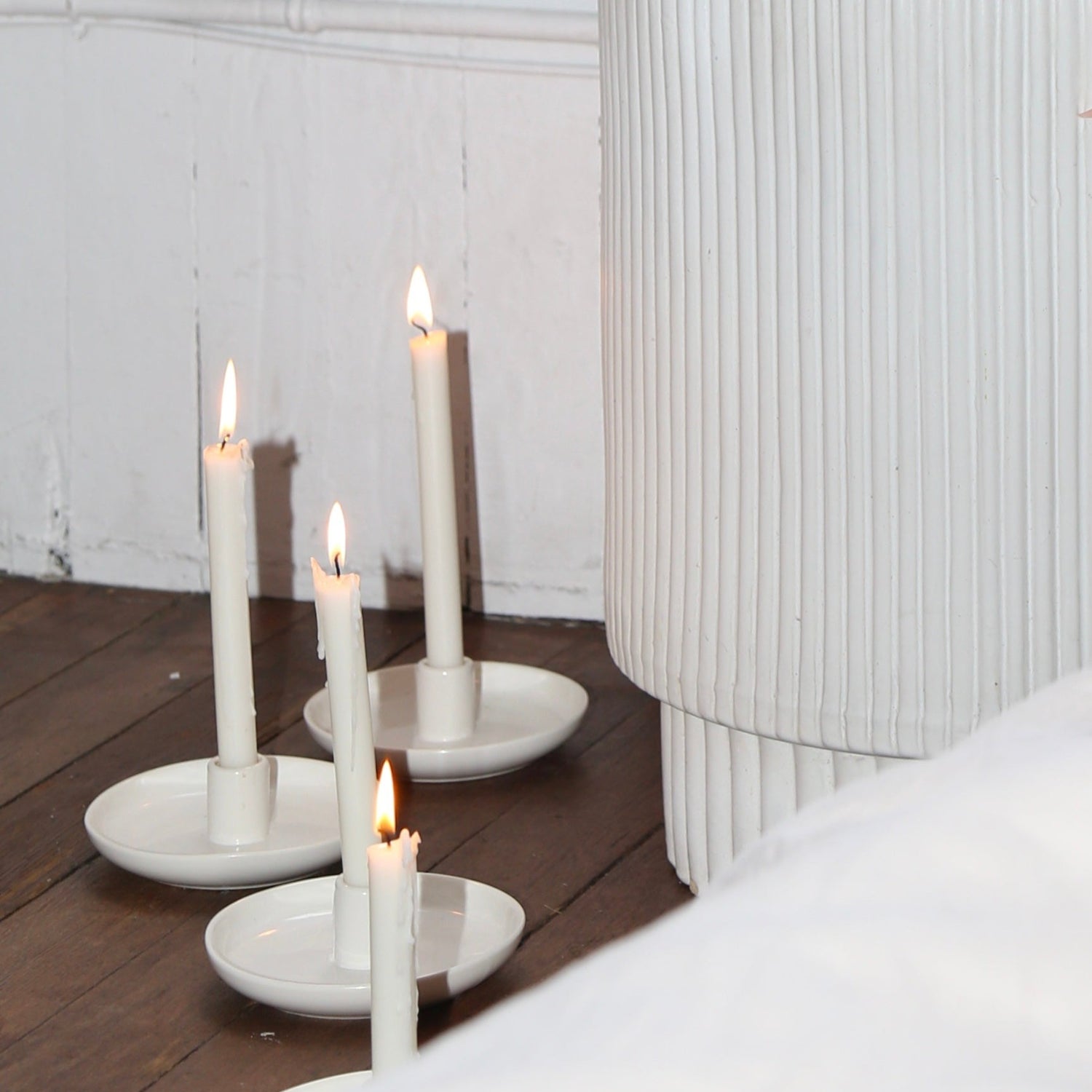Ceramic taper candle holder in glossy white available at Rook & Rose.