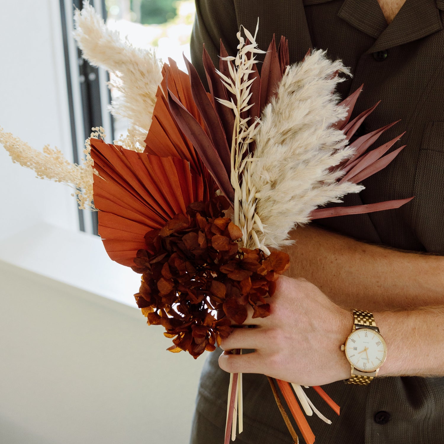 Photo is an example of a small earthy dried bouquet.
