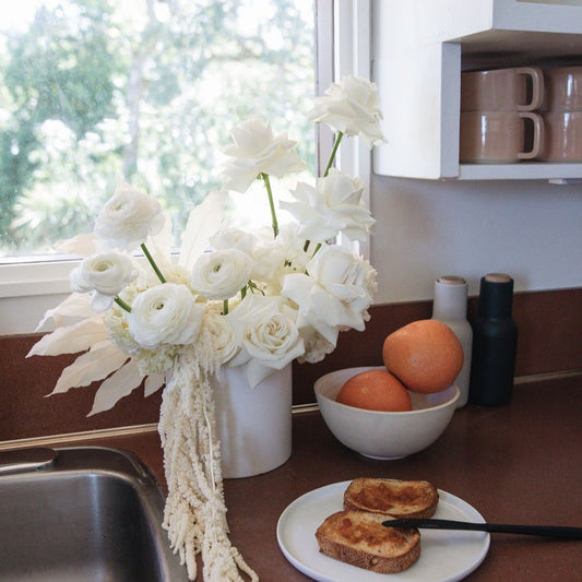 Photo is an example of an extra large neutral fresh arrangement.