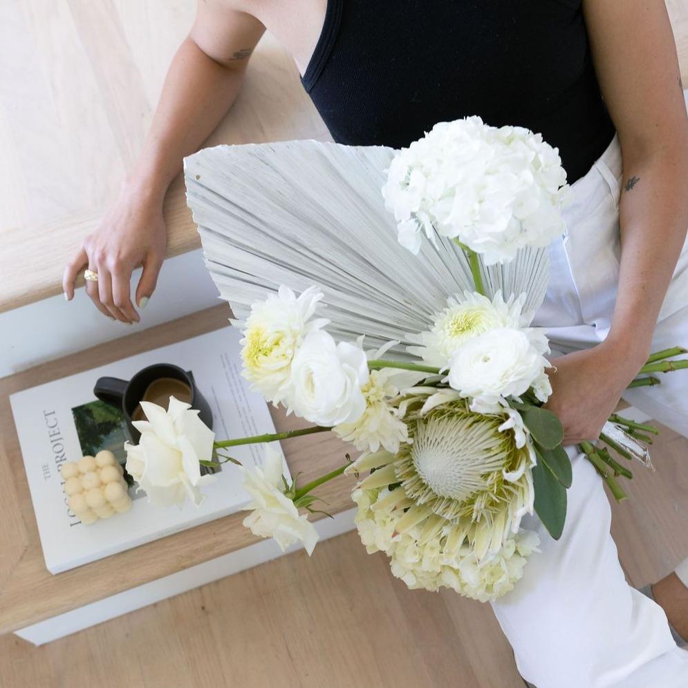 Photo is an example of a large neutral fresh bouquet.