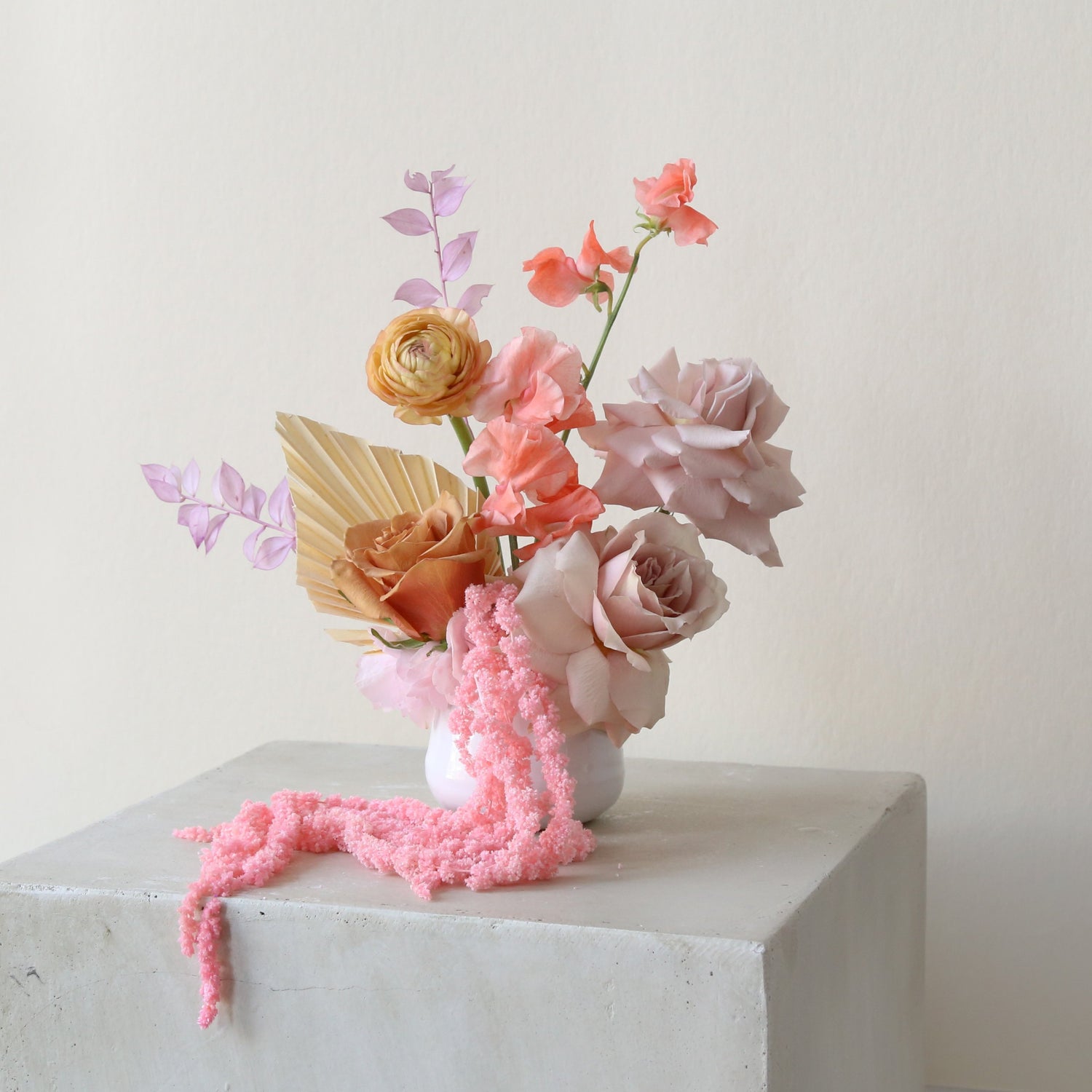 Photo is an example of a small pastel fresh arrangement.