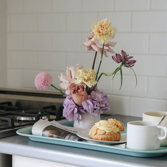 Photo is an example of a small pastel fresh arrangement.