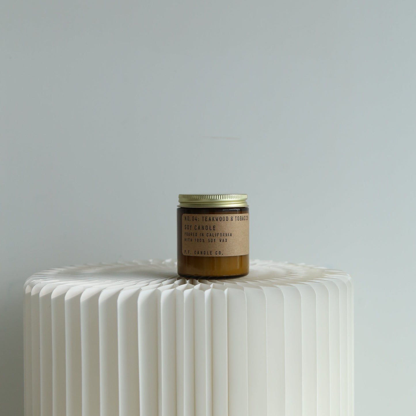 P.F. Candle Co mini teakwood and tobacco candle available at Rook & Rose.