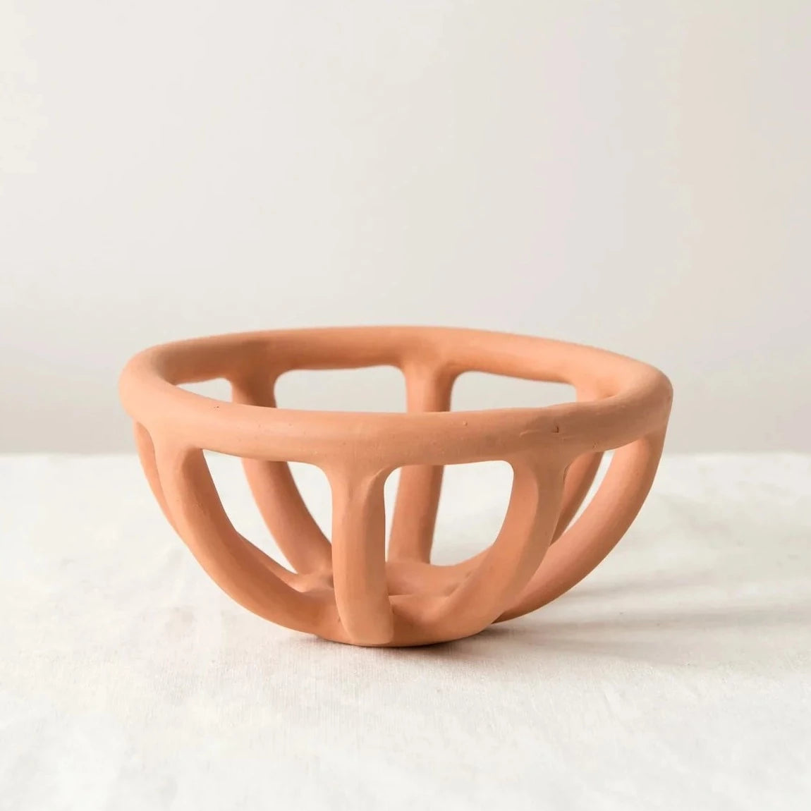 SIN prong fruit bowl in terracotta available at Rook & Rose.