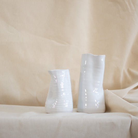 White 4" ceramic vase available at Rook & Rose