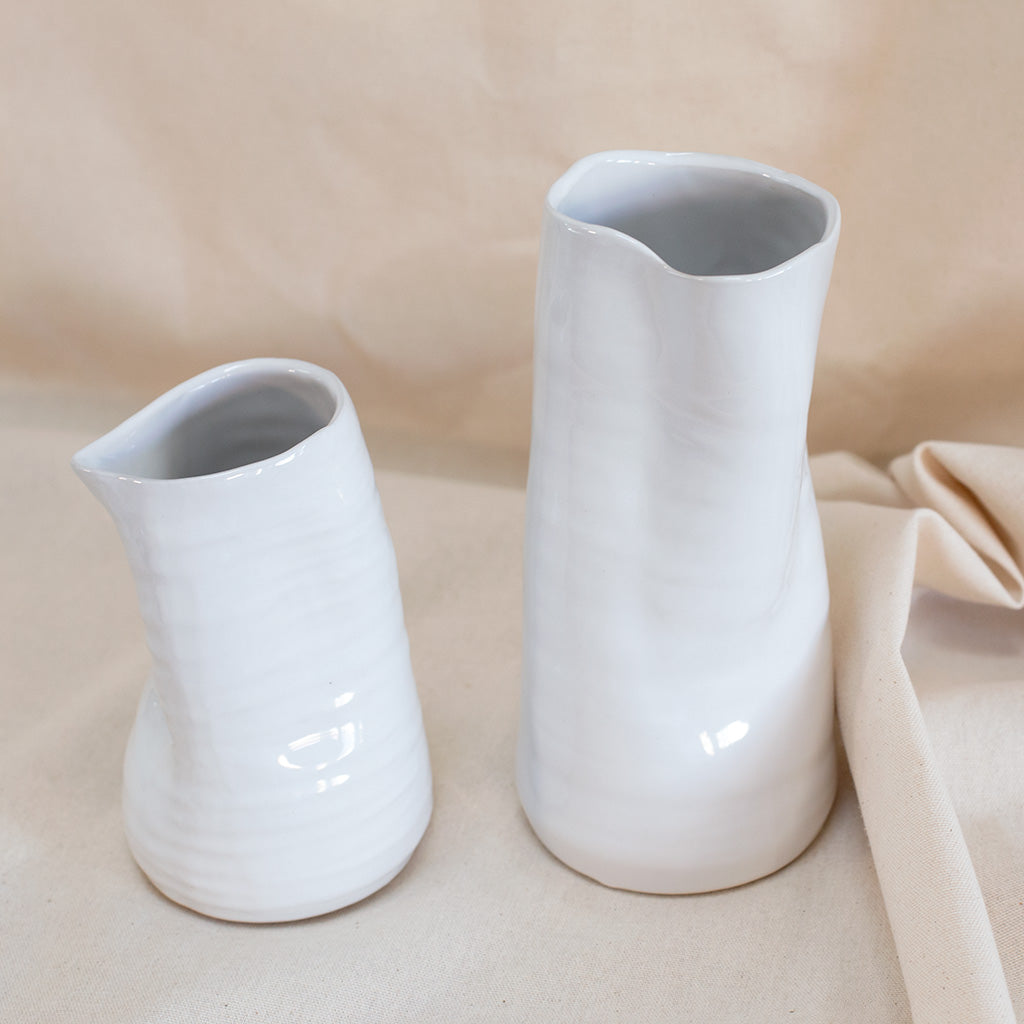 White 4" ceramic vase available at Rook & Rose